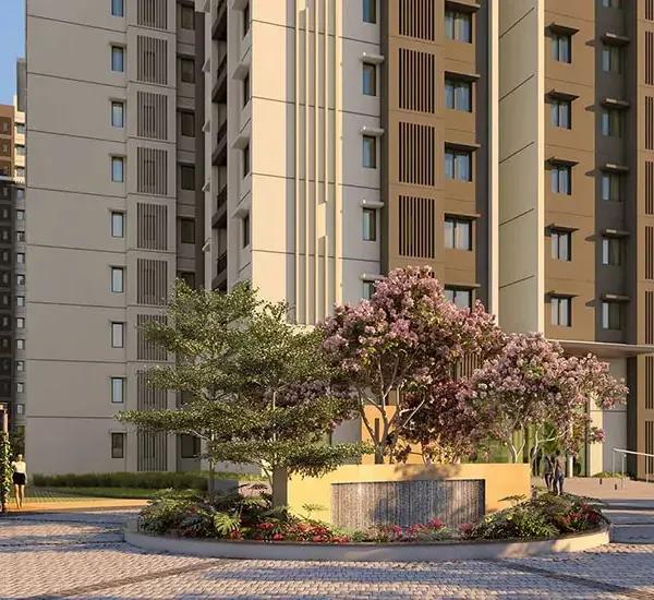 Brigade Citadel, Moti Nagar, artistic impression Towers behind a flowering tree and a water wall at Brigade Citadel